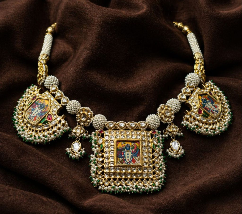 Gold necklace with miniature religious paintings, pearls, emerald beads, and diamonds on brown silk.